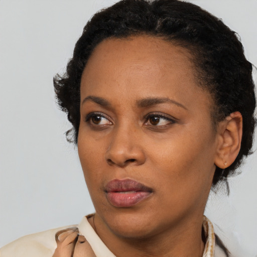 Neutral black young-adult female with short  black hair and brown eyes