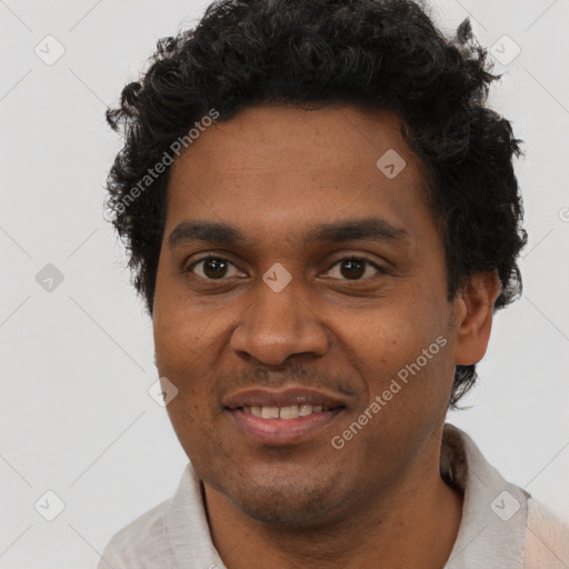 Joyful black young-adult male with short  brown hair and brown eyes