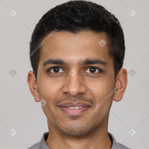 Joyful latino young-adult male with short  black hair and brown eyes