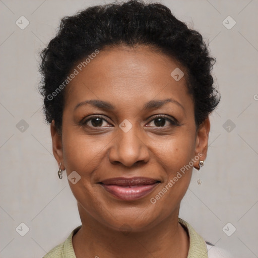 Joyful black adult female with short  brown hair and brown eyes