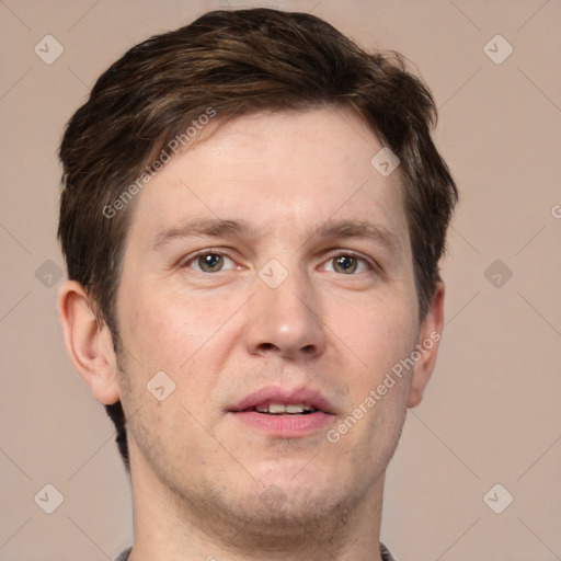 Joyful white adult male with short  brown hair and grey eyes