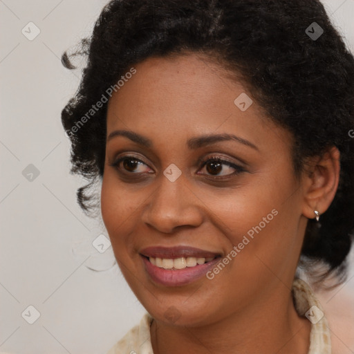 Joyful black young-adult female with long  brown hair and brown eyes