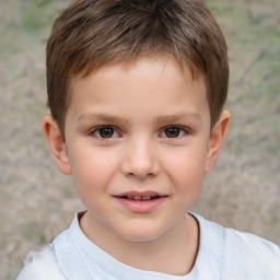 Joyful white child male with short  brown hair and brown eyes