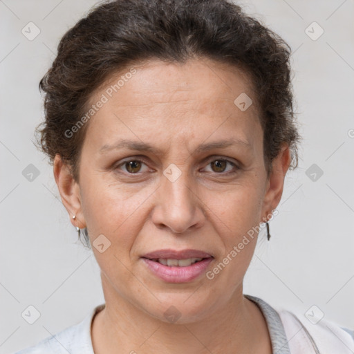 Joyful white adult female with short  brown hair and brown eyes