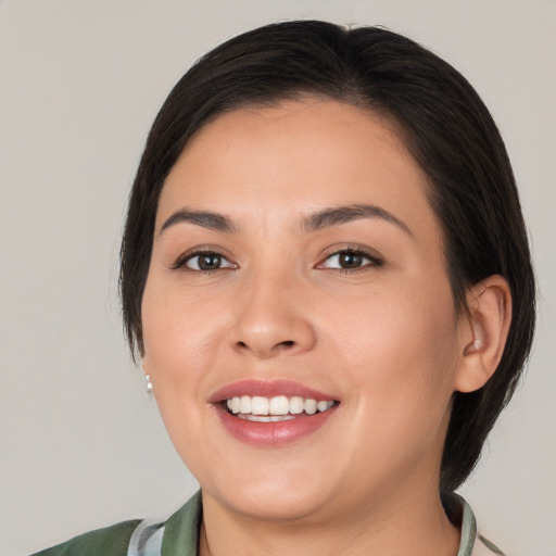 Joyful white young-adult female with medium  brown hair and brown eyes