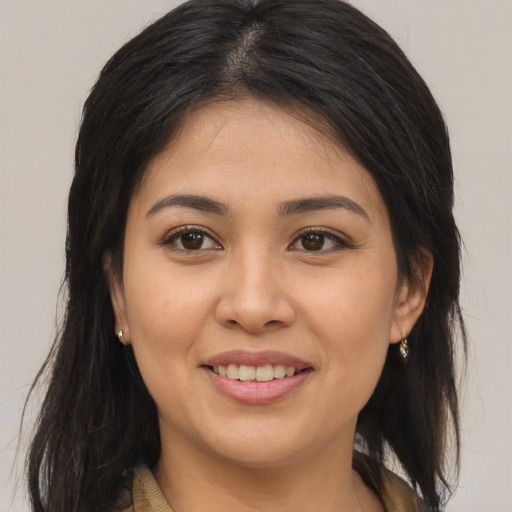 Joyful asian young-adult female with long  brown hair and brown eyes