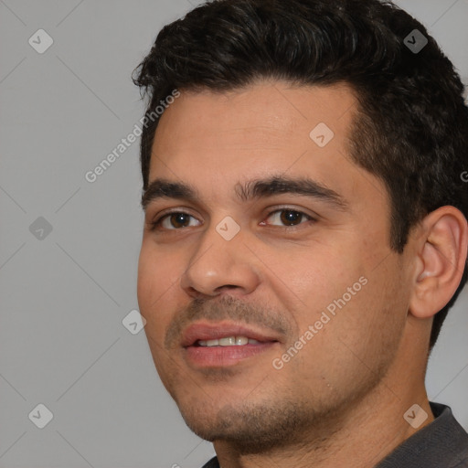 Joyful white young-adult male with short  black hair and brown eyes