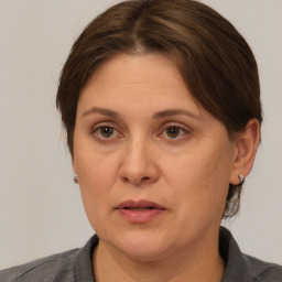 Neutral white adult female with medium  brown hair and brown eyes