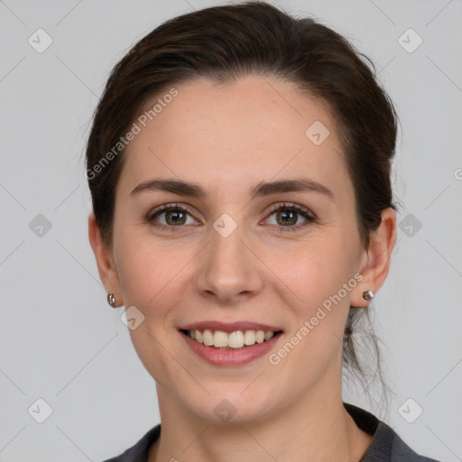 Joyful white young-adult female with medium  brown hair and grey eyes