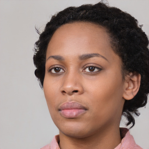 Neutral black young-adult female with long  black hair and brown eyes