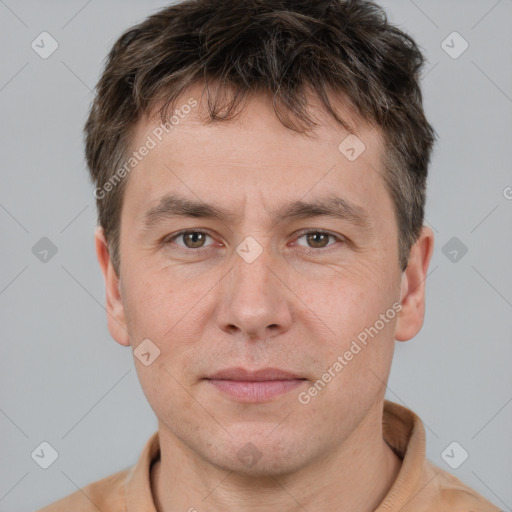 Joyful white adult male with short  brown hair and grey eyes