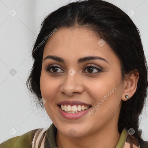 Joyful latino young-adult female with medium  brown hair and brown eyes