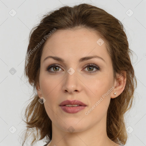 Joyful white young-adult female with medium  brown hair and green eyes