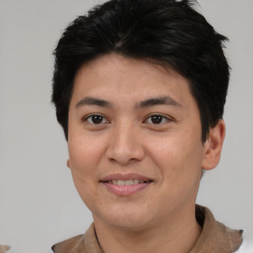 Joyful asian young-adult female with short  brown hair and brown eyes