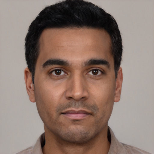 Neutral latino young-adult male with short  black hair and brown eyes