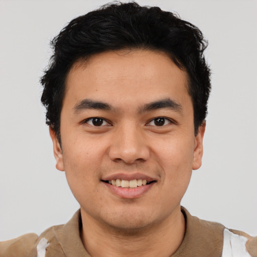 Joyful asian young-adult male with short  black hair and brown eyes