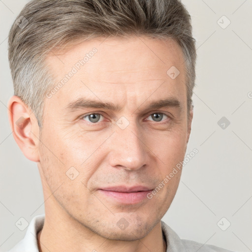 Joyful white adult male with short  brown hair and grey eyes