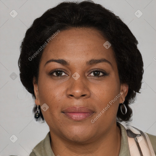 Joyful black adult female with short  brown hair and brown eyes