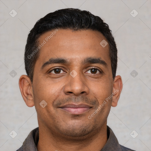 Joyful latino young-adult male with short  black hair and brown eyes