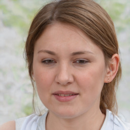 Joyful white young-adult female with medium  brown hair and blue eyes