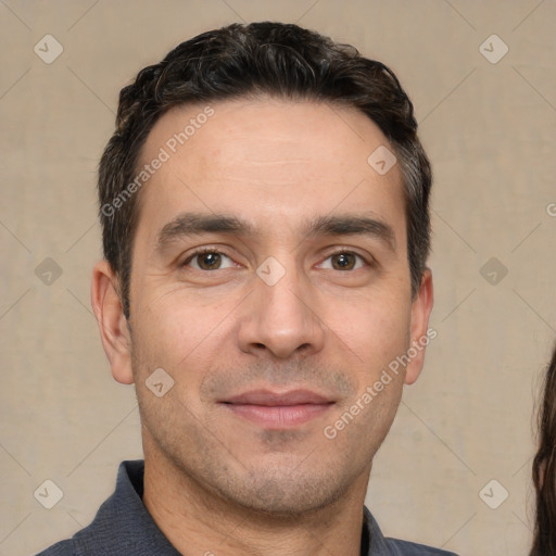 Joyful white adult male with short  brown hair and brown eyes