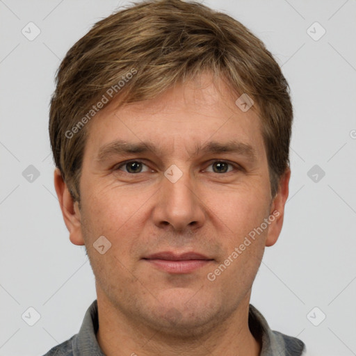 Joyful white adult male with short  brown hair and grey eyes