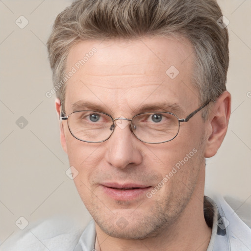 Joyful white adult male with short  brown hair and grey eyes