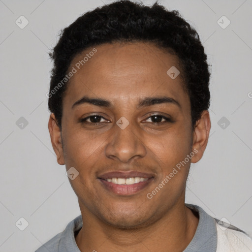 Joyful black young-adult female with short  black hair and brown eyes