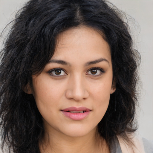 Joyful asian young-adult female with long  brown hair and brown eyes