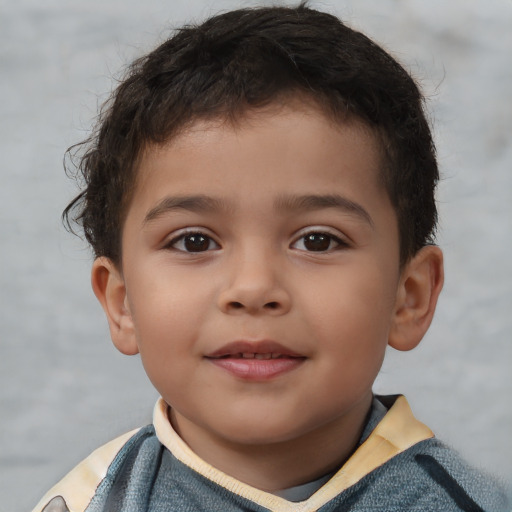 Joyful white child male with short  brown hair and brown eyes