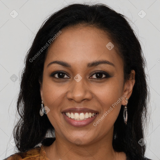 Joyful black young-adult female with long  brown hair and brown eyes