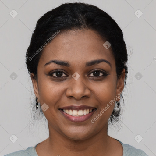 Joyful black young-adult female with medium  black hair and brown eyes