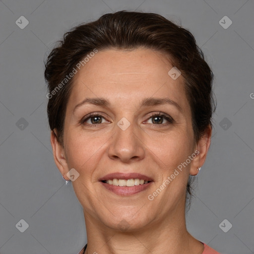 Joyful white adult female with short  brown hair and brown eyes