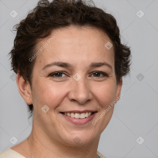 Joyful white adult female with short  brown hair and brown eyes