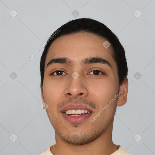 Joyful latino young-adult male with short  black hair and brown eyes