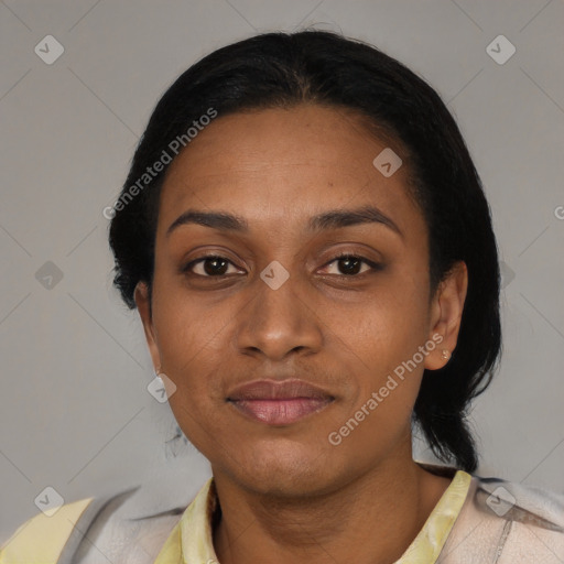 Joyful black adult female with short  black hair and brown eyes