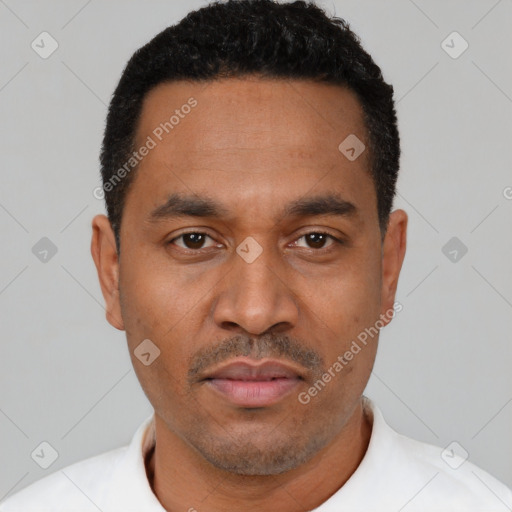 Neutral latino young-adult male with short  black hair and brown eyes