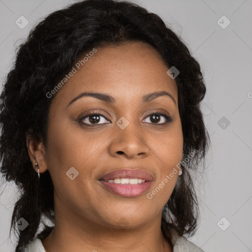 Joyful black young-adult female with long  brown hair and brown eyes