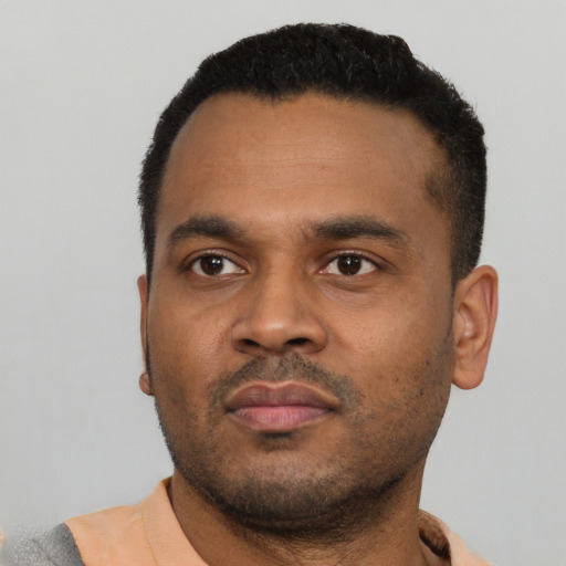 Neutral latino young-adult male with short  black hair and brown eyes