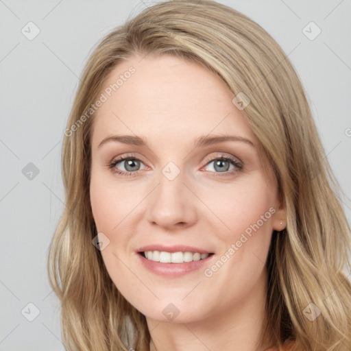 Joyful white young-adult female with long  brown hair and blue eyes