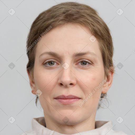 Joyful white adult female with short  brown hair and grey eyes