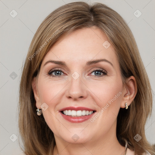 Joyful white young-adult female with medium  brown hair and grey eyes