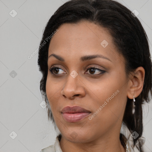 Joyful black young-adult female with medium  black hair and brown eyes