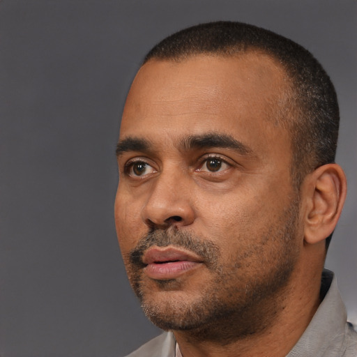 Neutral black adult male with short  black hair and brown eyes