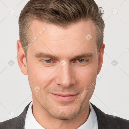 Joyful white adult male with short  brown hair and grey eyes