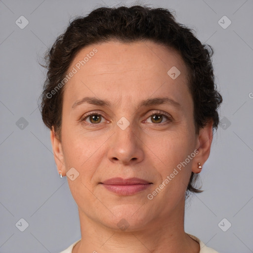 Joyful white adult female with short  brown hair and brown eyes