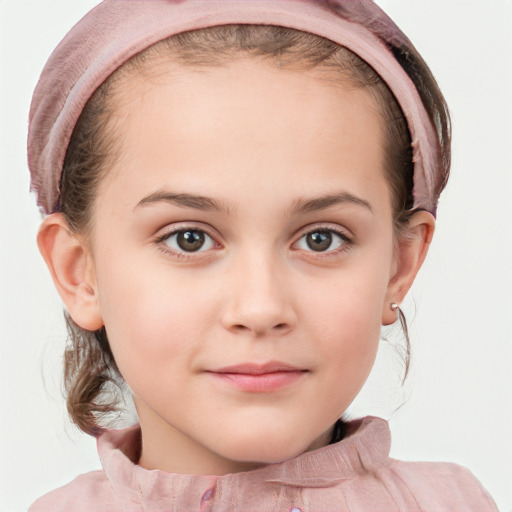 Joyful white child female with short  brown hair and blue eyes