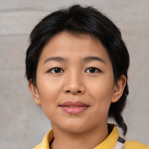 Joyful asian young-adult female with medium  brown hair and brown eyes