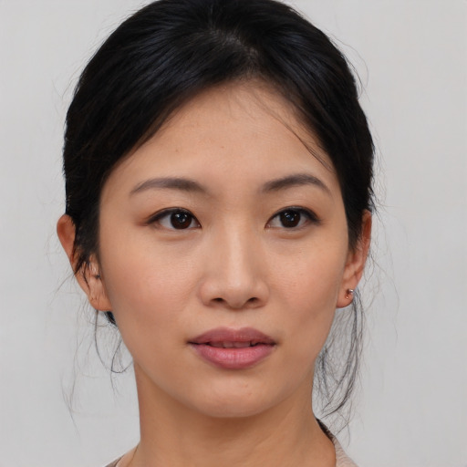 Neutral asian young-adult female with medium  brown hair and brown eyes