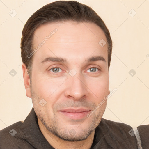 Joyful white adult male with short  brown hair and brown eyes